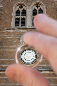 View of clock through a wedding ring - Issi Greig wedding photography